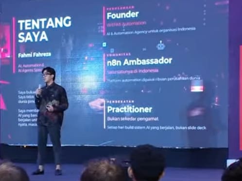 Fahmi Fahreza delivering his session at the Lenovo Indonesia event, on stage with his speaker-profile slide on screen